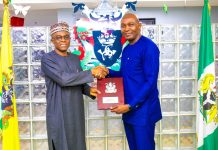 L-R pix shows the Managing Director of NPA, Dr Abubakar Dantsoho presenting the Agency’s plaque Dr.Phillip Mshelbila, Chief Executive Officer of NLNG