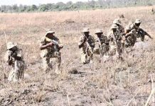 Troops neutralize notorious terrorist kingpin, seize caches of arms